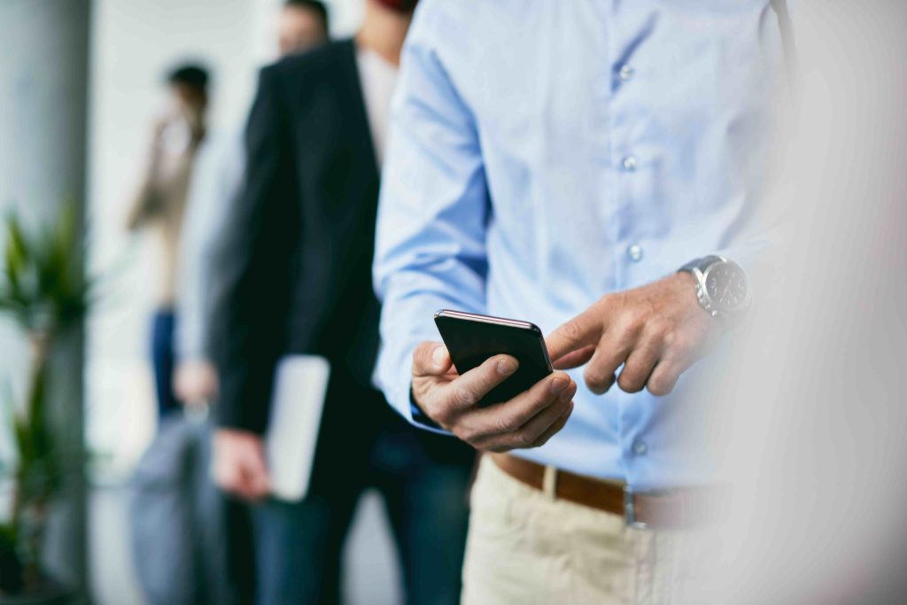 A phone held in one hand, mid-conversation