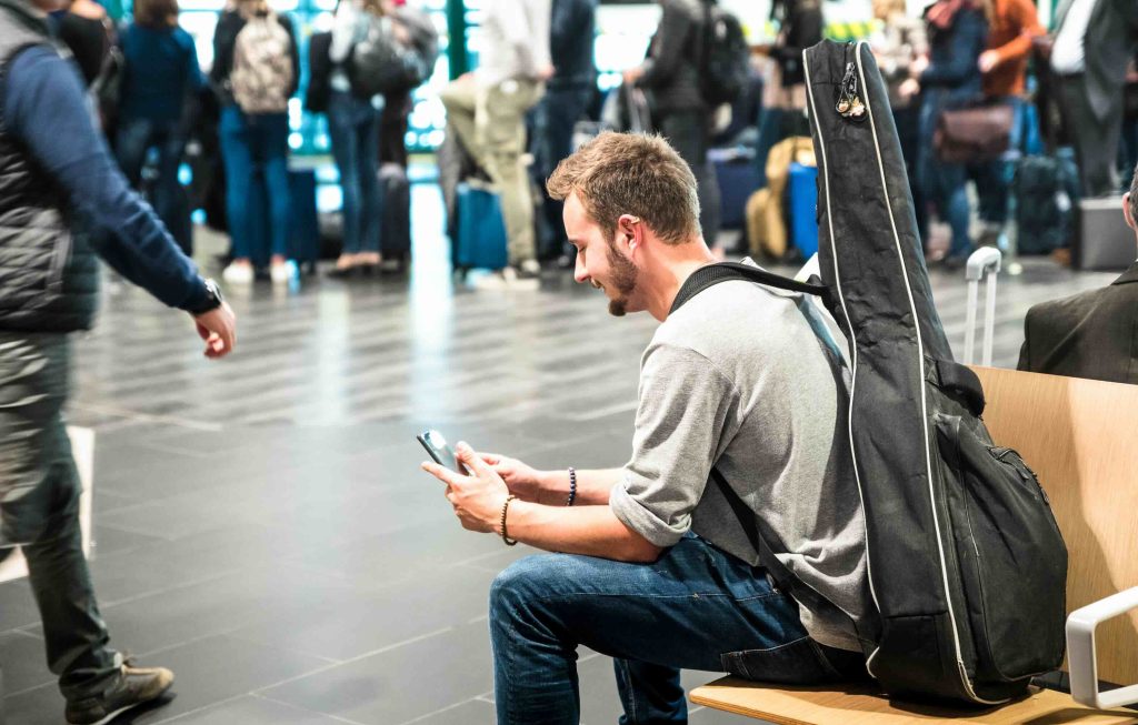 A delegate checking event information on his phone