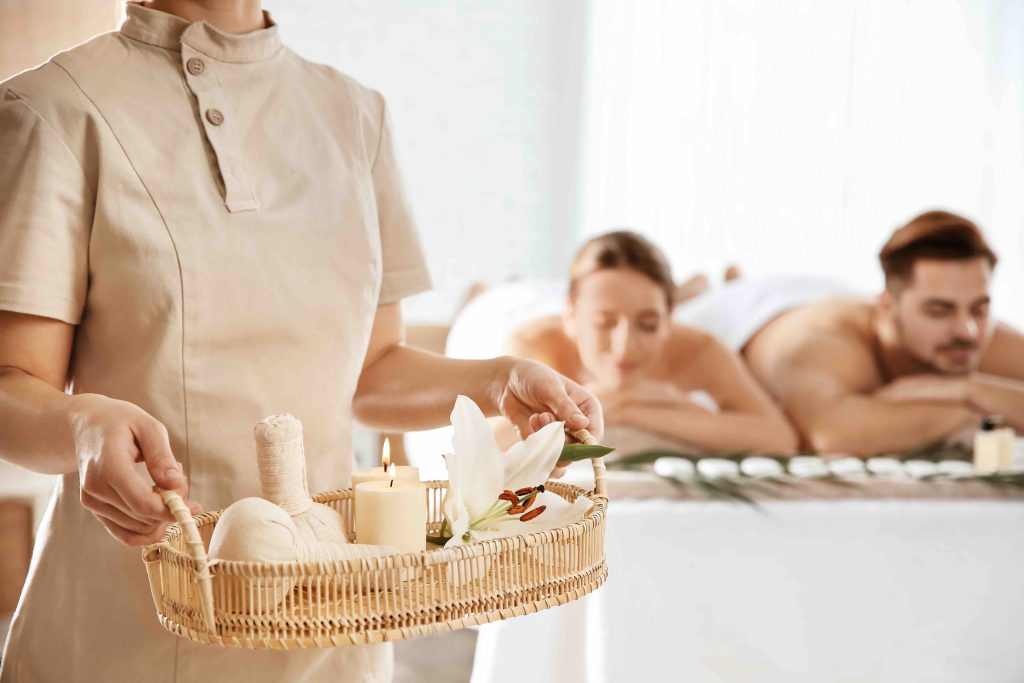 A spa therapist preparing treatments, one of the guest interests a hotel audience can be segmented around